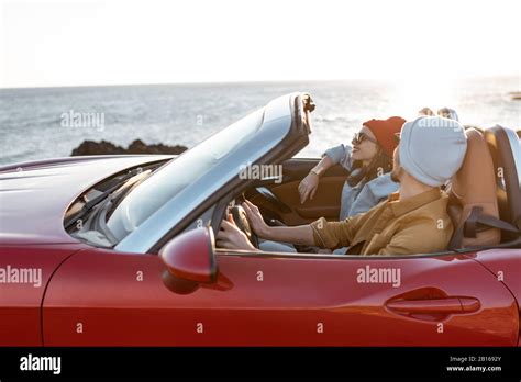 Joyful Couple Enjoying Vacations Driving Together Convertible Car On