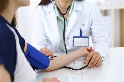 Doctor Checking Blood Pressure Of The Patient Closeup Cardiology In
