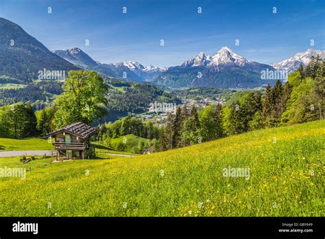 Idyllic Mountain Scenery With Traditional Mountain Chalet In The Alps