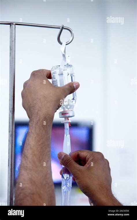 Adjusting The Flow Rate Of An Intravenous Iv Drip In A Hospital