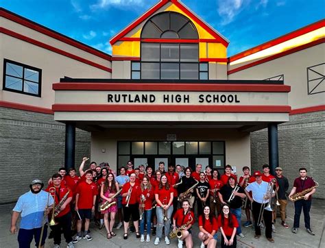 Download Rutland High School Band Posing Outside Of The Building