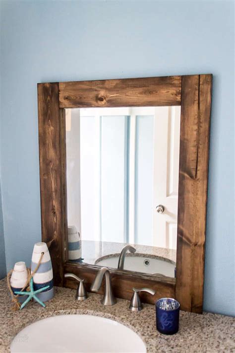 A mirror with a rustic frame can add a warm touch to a bathroom for example. DIY Rustic Bathroom Mirror - Domestically Speaking