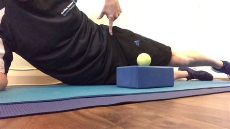 Quadriceps Flossing With A Foam Block And Tennis Ball Self Massage