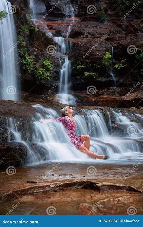 Exhilaration In Mountain Waterfall Female Sitting In Flowing Ca Stock