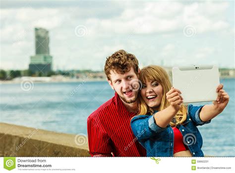 Young Couple Taking Self Picture Selfie With Tablet Stock Image Image Of Outdoors Women 59992231