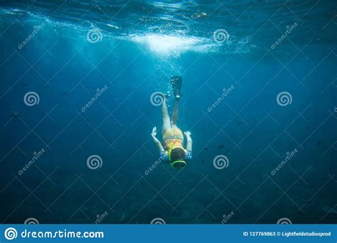 Underwater Photo Of Woman In Fins Diving Mask And Snorkel Diving Alone In Ocean Editorial Stock