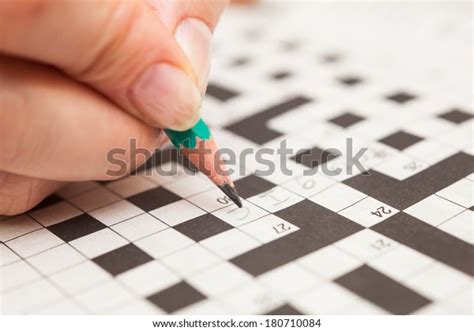 Crossword Puzzle Closeuphand Doing Crossword Stock Photo Edit Now
