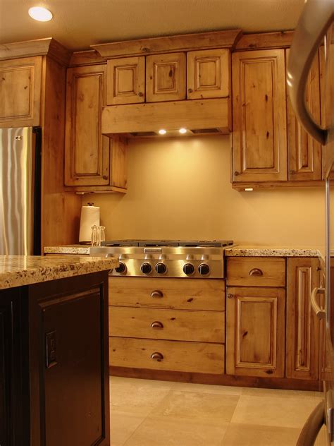 Choice of stain is a medium dark brown and expresso for bathroom. LEC Cabinets: Rustic Knotty Alder Cabinets