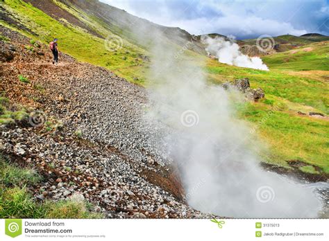 Woman Hiking In Beautiful Geothermal Landscape In Iceland