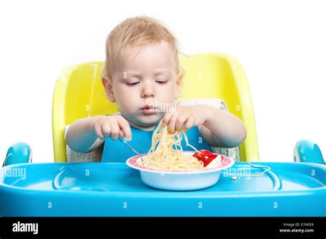 Little Blond Boy Eating Spaghetti Stock Photo Alamy