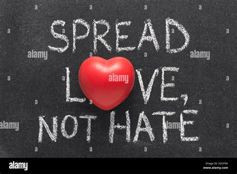 Spread Love Not Hate Phrase Handwritten On Blackboard With Heart