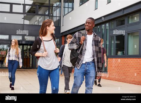 Group Of Students Walking Outside College Buildings Stock Photo Alamy