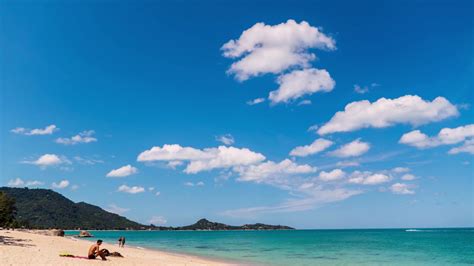 Tropical Beach In Paradise With Azure Sea And Blue Sky Time Lapse