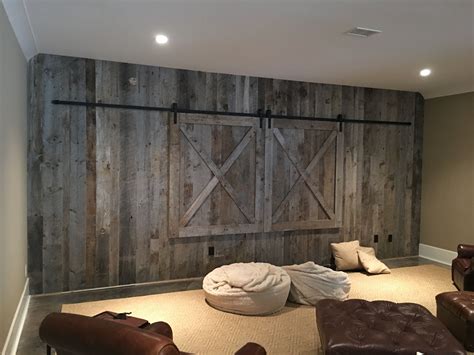 Barn doors hide the big screen TV in this beautiful residential wall design. | Wall design, Wall ...