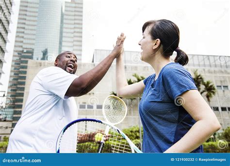 Couple Playing Tennis As A Team Stock Photo Image Of Friends
