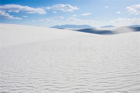 White Sand Dunes And Blue Cloudy Sky In New Mexico Desert Stock Image