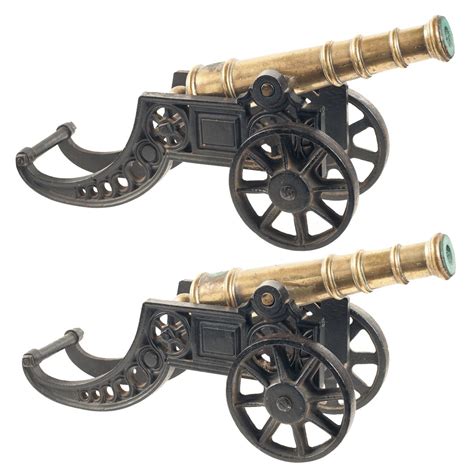 Matched Pair Of Two Miniature Cannons A Brass Cannon With Cast Iron