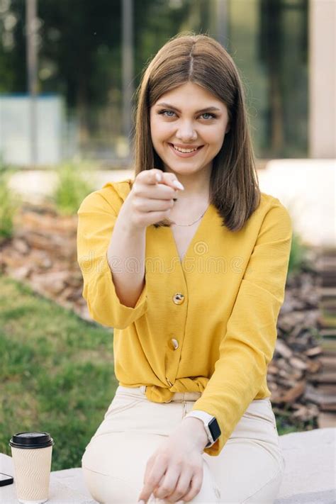beautiful european ukraininan girl pointing index finger at camera inviting with hand gesture