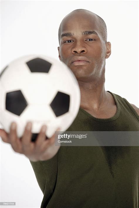Soccer Player Holding Ball High Res Stock Photo Getty Images