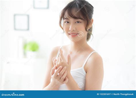 Beautiful Young Asian Woman Applying Cream And Treatment For Skin Care Touch On Hand Asia Girl