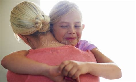 I Love You So Much A Cute Little Girl Hugging Her Mom With A Happy
