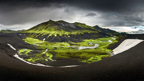 Landscape View Of Green And Black Covered Mountain In