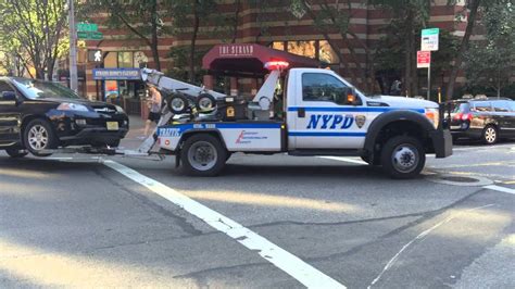 Nypd Tow Truck Towing A Car On 10th Avenue In The Hells Kitchen Area