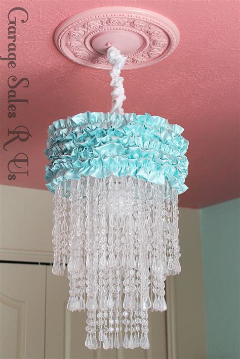 … we just slipped the shade onto the rod protruding from the ceiling and used the finial (leftover from the previous light fixture) to hold it in place. Garage Sales R Us: DIY Chandelier