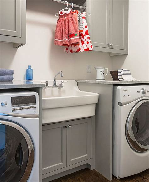 Moving up to the $100 to $250 range, you'll find the largest variety of utility sinks. Laundry room with grey cabinets, vintage style sink and ...