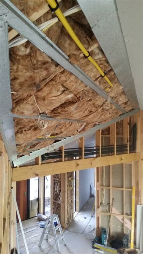 The challenge with hanging ceilings, is moving the drywall into place. How To Install Drywall On Sloped Ceiling | Nakedsnakepress.com