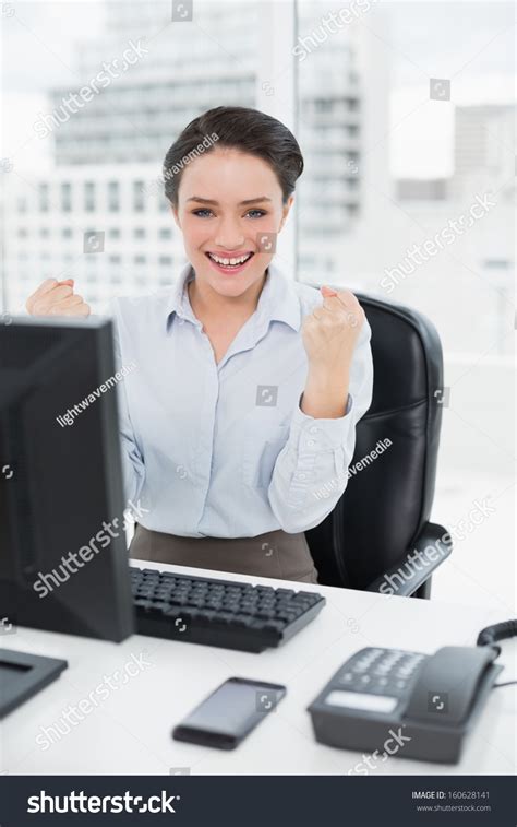 Portrait Excited Businesswoman Clenching Fists Office Stock Photo