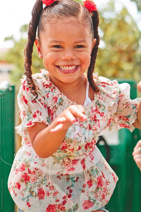 Young Latina Girl On Playground By Stocksy Contributor Jayme Burrows Stocksy