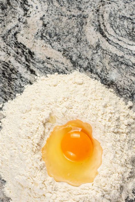 Mixing Dough With Flour And Egg On The Grey Kitchen Marble Creative
