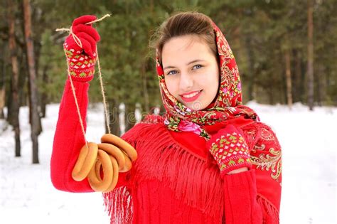 Fashion In Russian Style A Beautiful Girl In A Red Pavlovsky Posad Shawl Holds Bagels In The