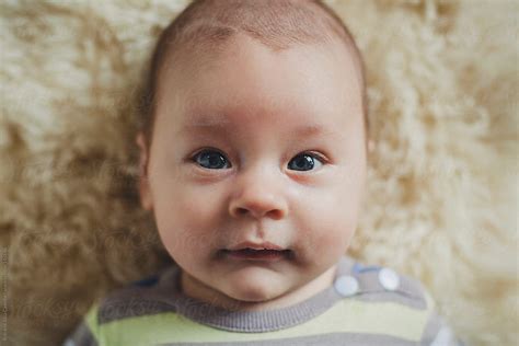 Serious Portrait Of Baby Boy At 2 Months Old By Stocksy Contributor