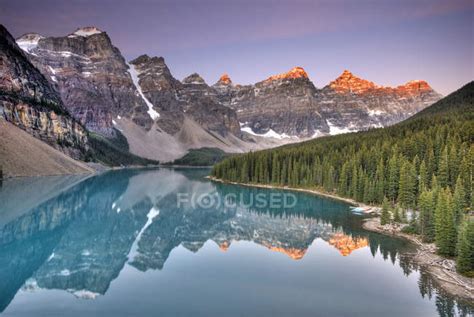 Moraine Lake With Rocky Mountains Reflection At Sunrise In Banff