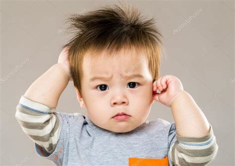Baby Boy Feeling Confused Stock Photo By ©leungchopan 46851529