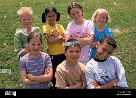 Group Of Seven Children Together In Parc Stock Photo Alamy