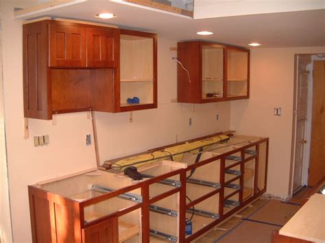 Set your base cabinets against the wall where you will install them, and add shims beneath the cabinetry so. 99+ How Do You Install Kitchen Cabinets - Remodeling Ideas ...