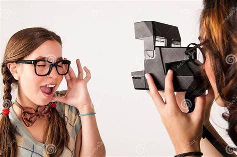 Young Nerdy Girls Using Instant Camera Stock Photo Image Of Cute