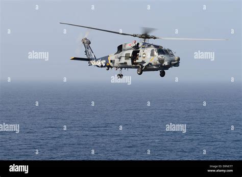 Us Navy Mh 60r Sea Hawk Helicopters Fly Operating From The Aircraft