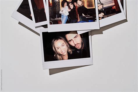 Polaroid Photo Of Beautiful Couple And Friends By Stocksy