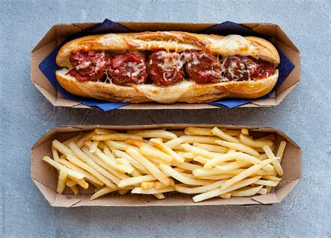 Meatball And Cheese Sub Sandwich With Fries By Stocksy Contributor Nadine Greeff Stocksy