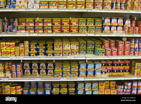 Assortment Of Variety Of Spam And Other Canned Meats On Grocery Store