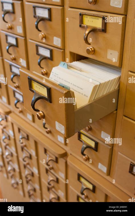 A Wooden Drawer Card Catalog In A Library Using The Dewey Decimal Stock