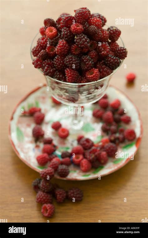 Still Life With Plate Glass And Japanese Wineberries Stock Photo Alamy