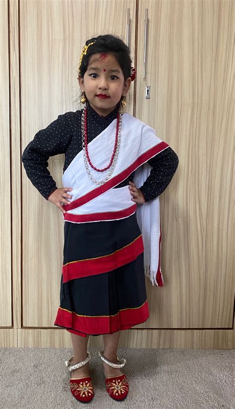 girl newari traditional dress set dress and jangawal suruwal patuki with red boarder muga red