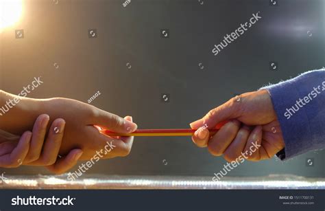 Closeup Teacher Holding Pencil Giving Pupil Stock Photo 1511700131