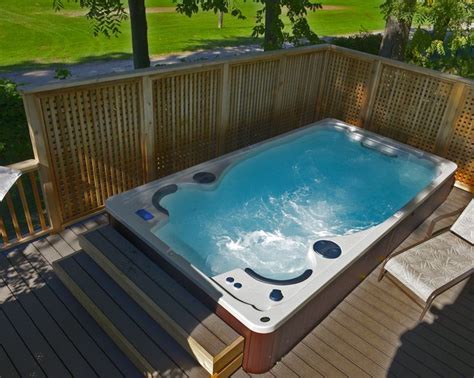 A Backyard Endless Pools Swim Spa Built Into A Raised Deck Swim Spa Or Pool Swim Spa Swim Spa