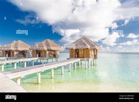 tropical beach in maldives with luxury over water bungalows or villas amazing sea lagoon with